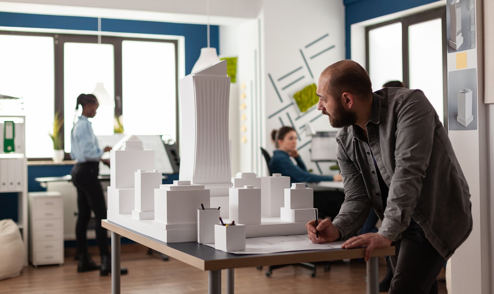 man-working-on-architectural-design-at-office-2022-07-15-22-16-09-utc